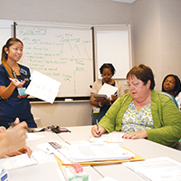 "group of nurses in a meeting"