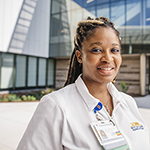 "medical professional female smiling at camera"