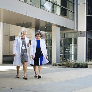 two uc davis health colleagues talking