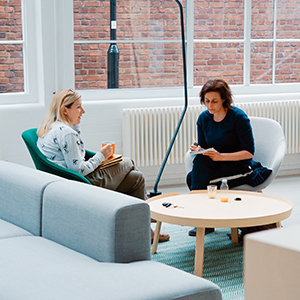 "two women having a discussion"