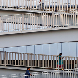 People walking on elevated ramps.