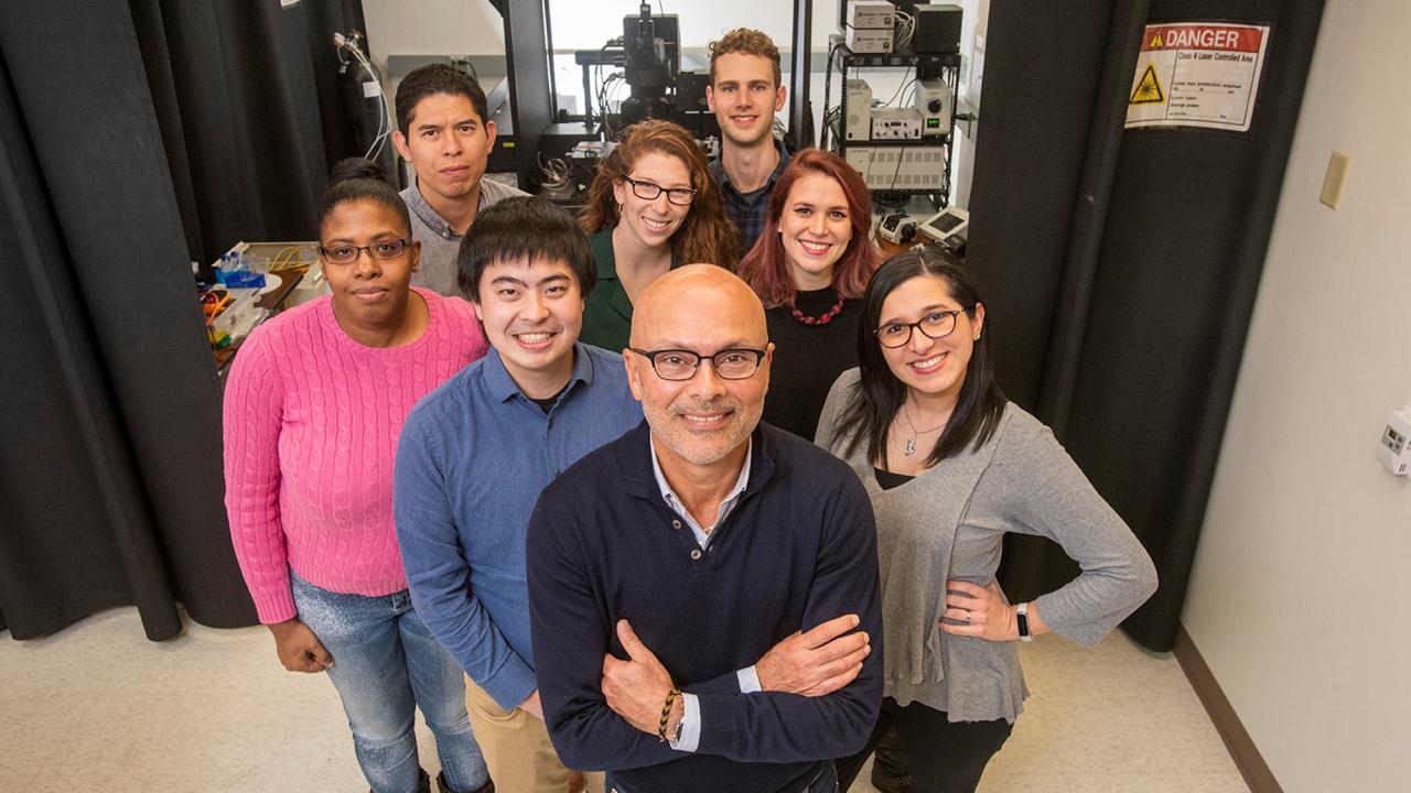 Professor Luis Fernando Santana, Department of Physiology and Membrane Biology, and his lab team in Tupper Hall on the Davis campus, early February 2020, prepandemic. Pictured (clockwise from lower left, behind the professor): Collin Matsumoto, Dellaney Rudolph, Eric Arreola, Samantha O'Dwyer, Nathan Grainger, Laura Guarina and Stephanie Palacio. (Karin Higgins/UC Davis)