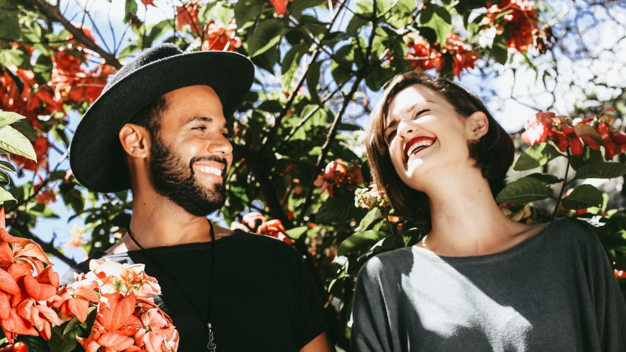 young man and woman smiling
