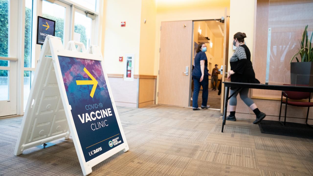 COVID-19 Vaccine Clinic sign at entrance to Davis Campus clinic