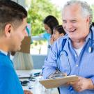 A physician consulting with a male patient. 